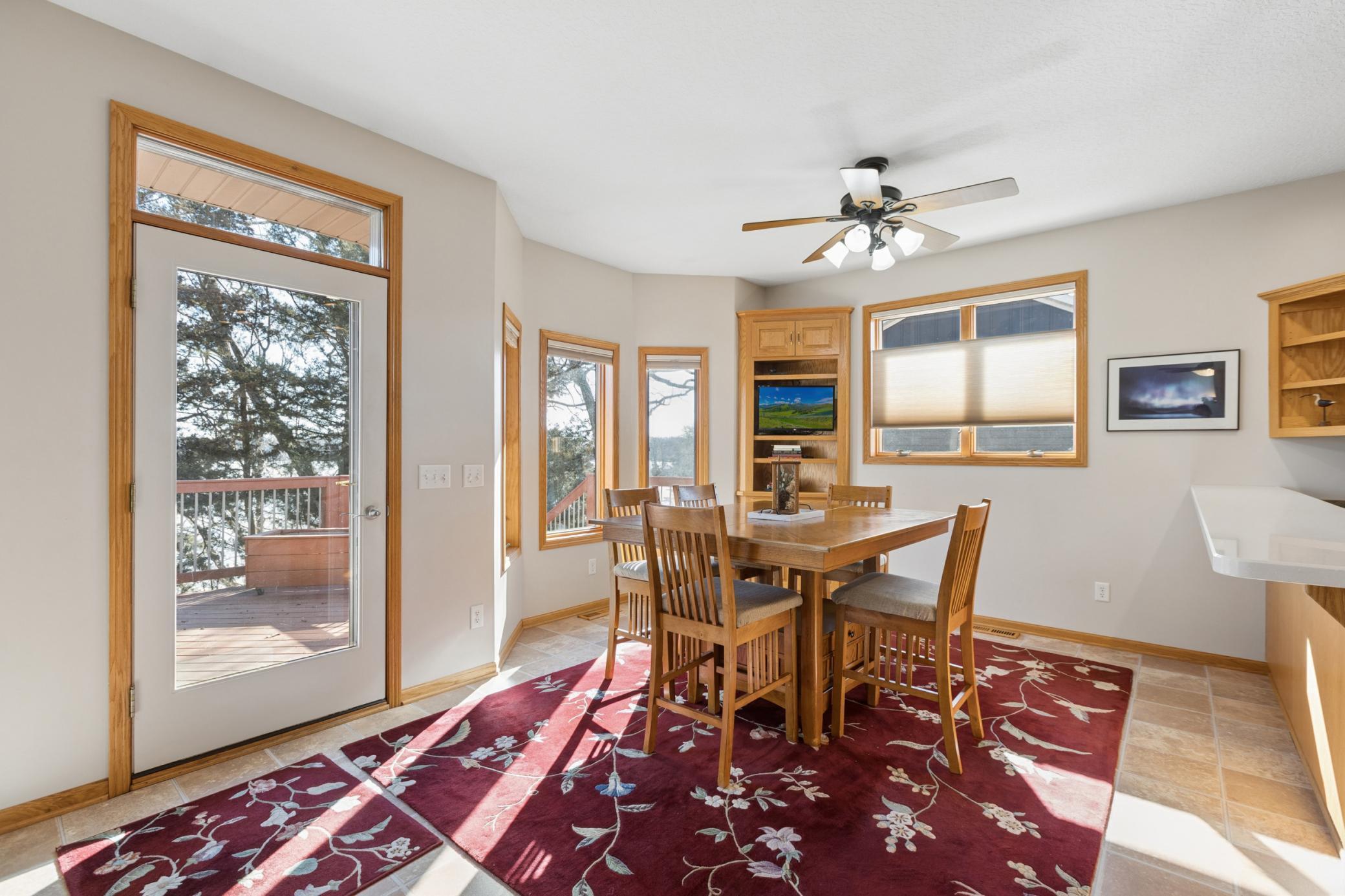 View of the informal dining room overlooking the shores of Cedar Lake. This is a property you must see in person to appreciate. This home is ready for you to move in and start enjoying all that Cedar Lake has to offer! A quick closing is possible.
