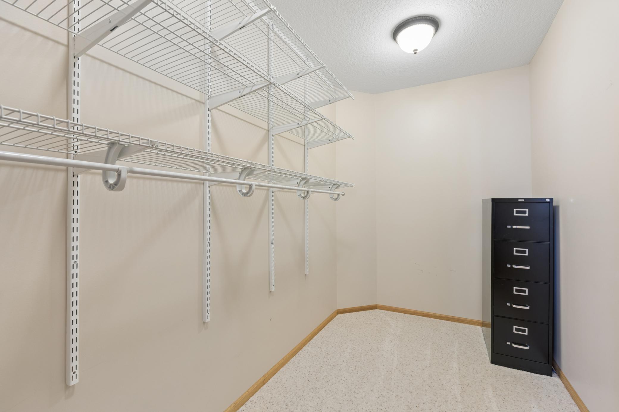 View of the walk-in closet measuring 7x12 in the lower-level bedroom.