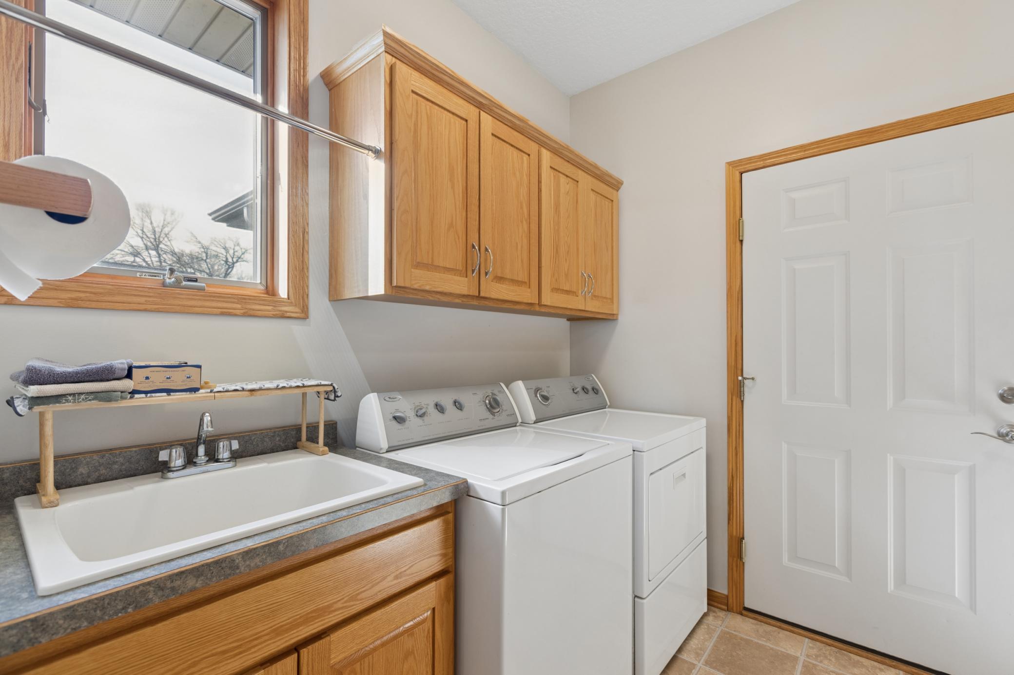 Located between the kitchen and the three stall, heated, attached garage is the laundry room/mud room with a large closet and plenty of storage. This great location is off an asphalt road with natural gas, buried power lines and fiber optic internet.