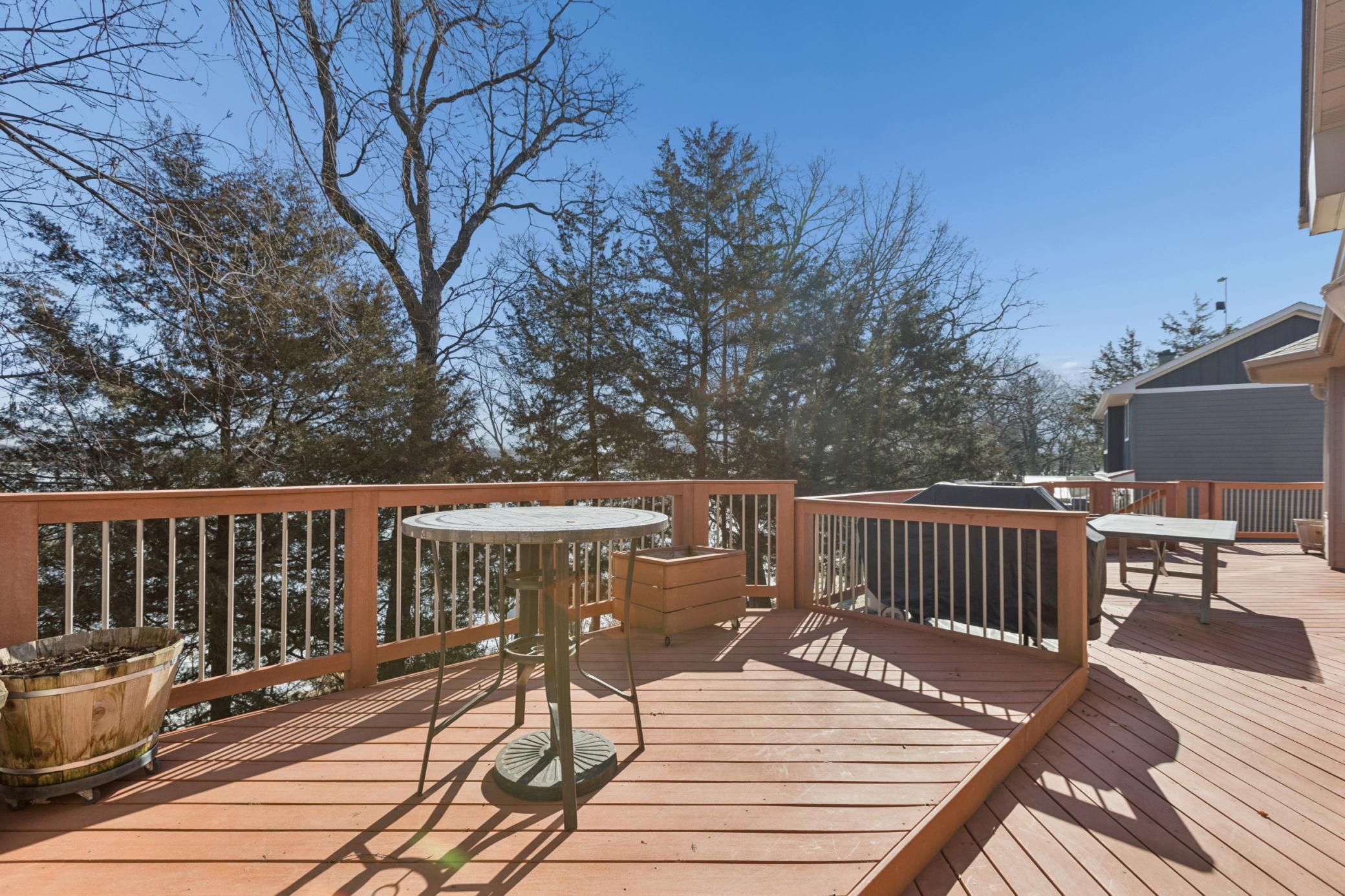 The deck spans the entire lakeside of the home reaching all the way over to the primary bedroom suite. Can you picture yourself enjoying your morning coffee as you watch the sun rising over the tranquil waters of Cedar Lake?