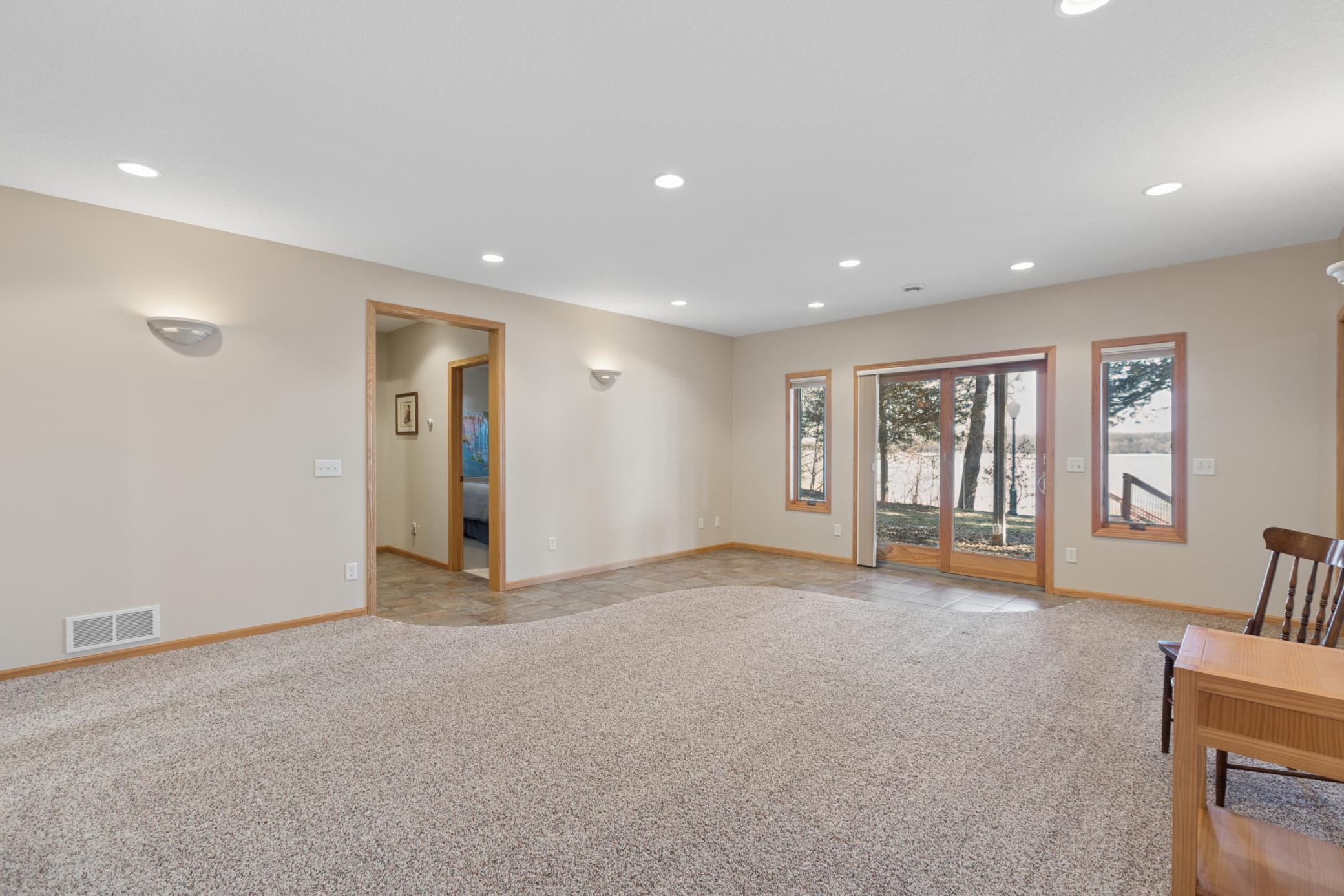 As you enter the home from the sliding patio door lakeside you will appreciate the heated tile floors that are perfect for traffic coming and going from the lake!
