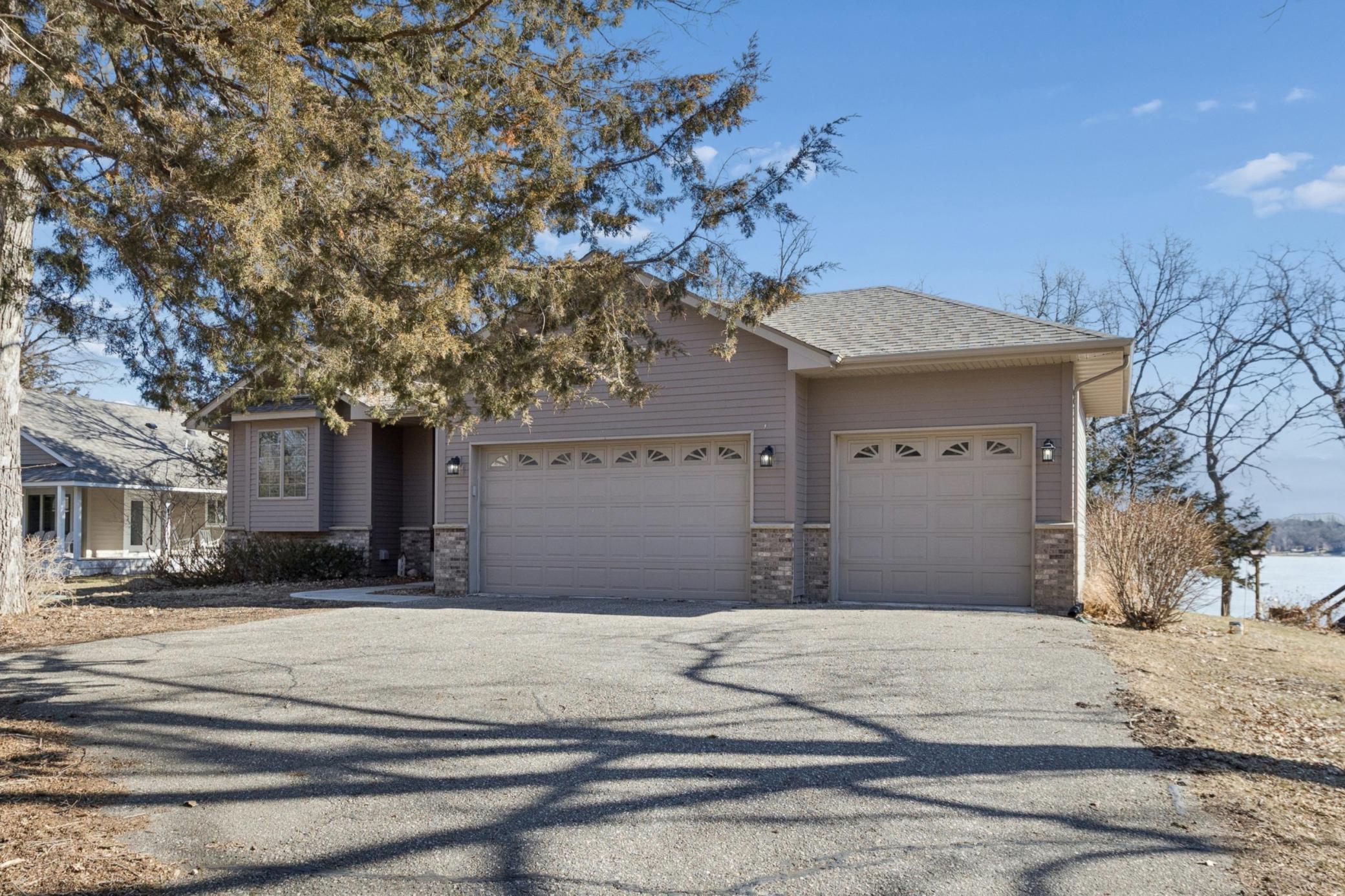 You will fall in love with all that this Cedar Lake property has to offer from the moment you pull in the driveway. From the sunrise views, mature trees and three stall, heated attached garage you are sure to be impressed.