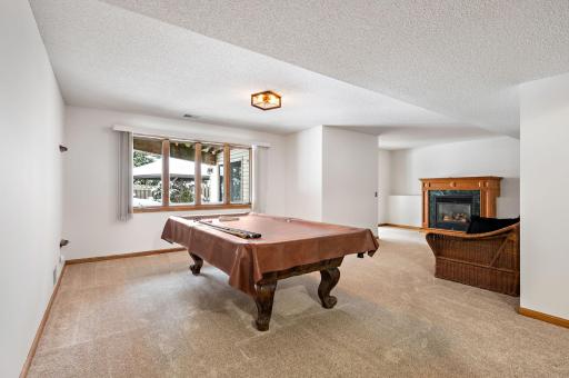 Walkout Lower Level has 2 bedrooms, Large Recreation Room with gas fireplace, 3/4 bathroom, storage room (20x12) and Awesome Bar/Sitting Area next to pool - GREAT FOR ENTERTAINING!