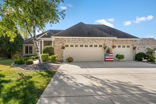 Welcome to this custom-built executive rambler located in the highly sought-after Swan Lake development of Plymouth.