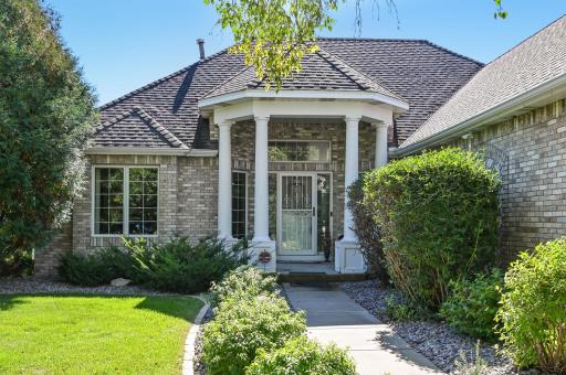 Great curb appeal with covered brick front entry