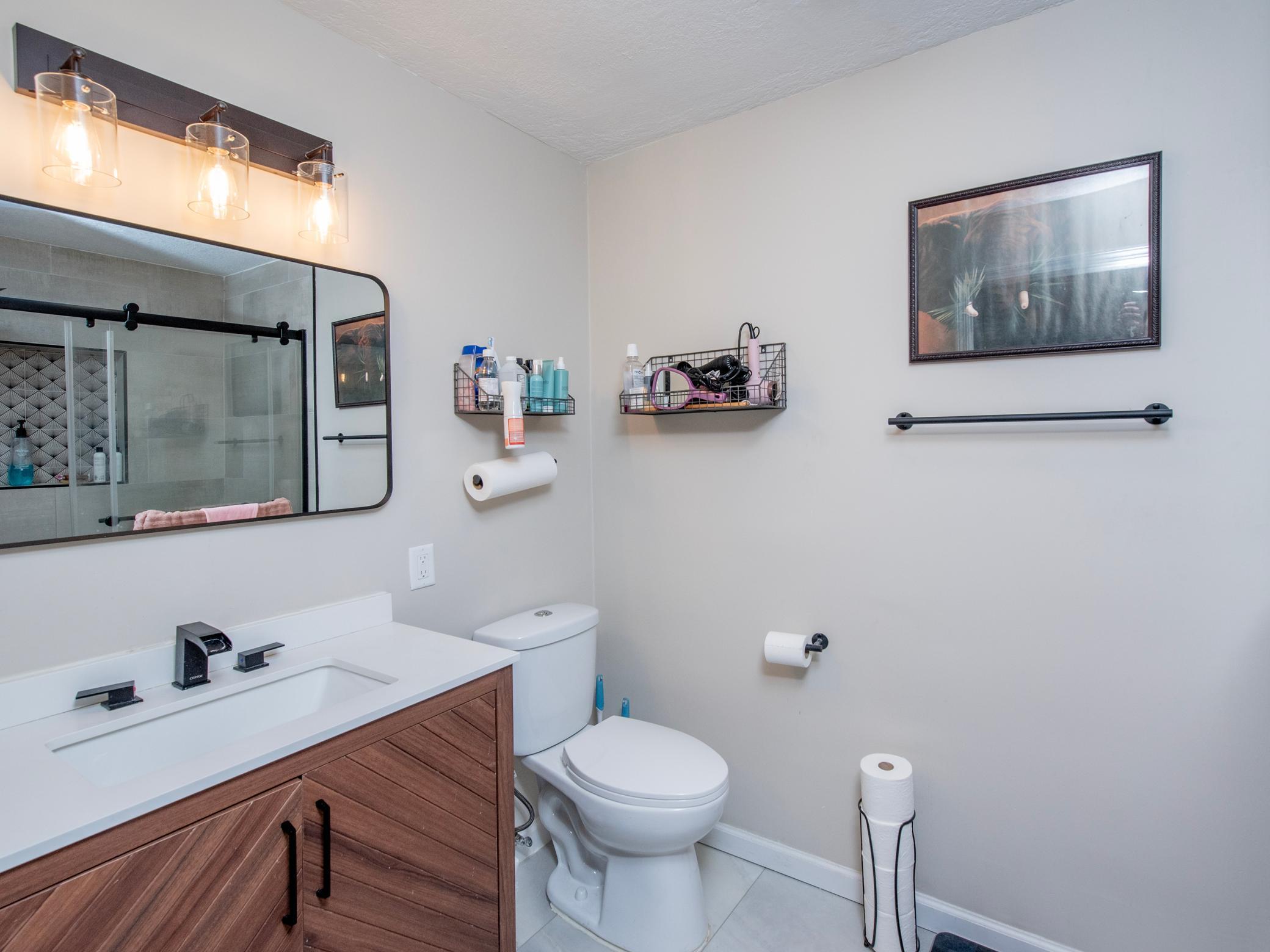 Upper level updated 3/4 ensuite bathroom.