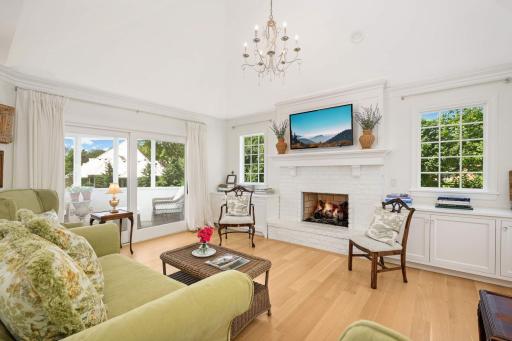 The family room has a gas fireplace, and also provides access to the porch, as well as lots of light from the sliding doors.