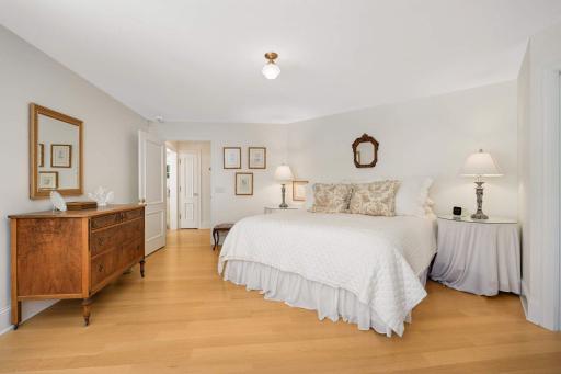 The main floor bedroom has corner windows that overlook the backyard, southern facing exposure.