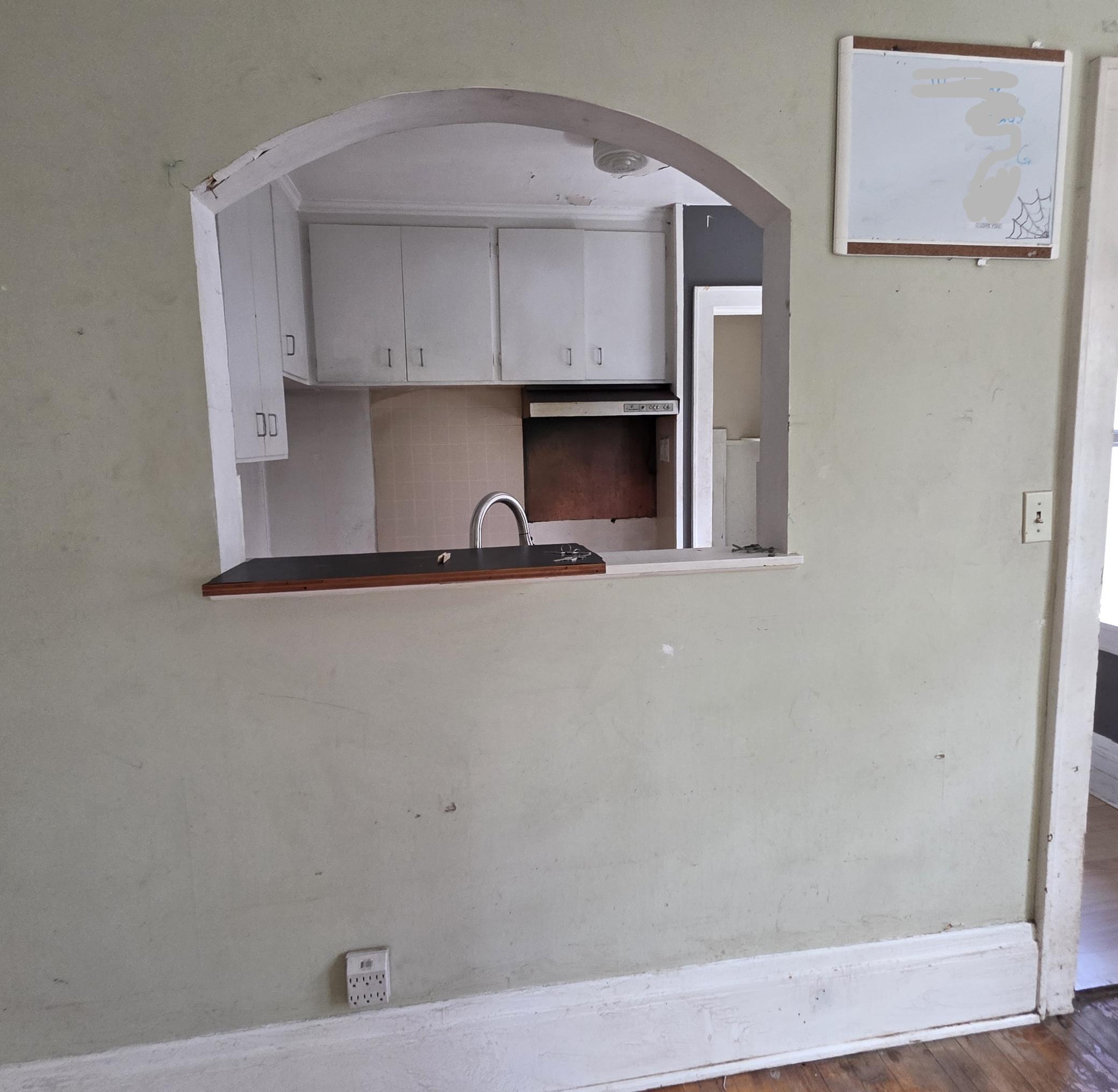 Kitchen opening up to dining room