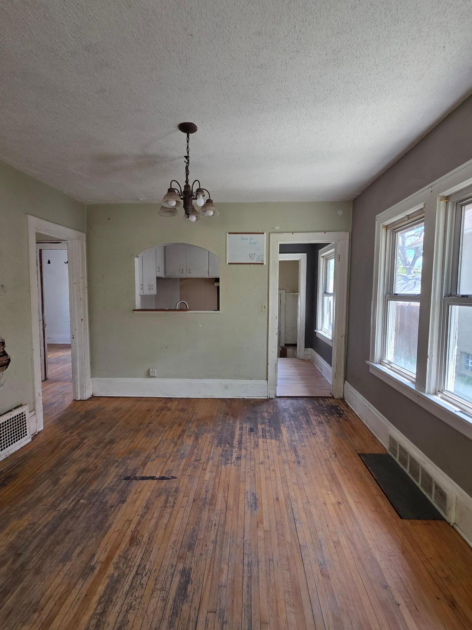 Bring the floor sander; floors will look great once refinished! Open layout: kitchen opened up to dining room