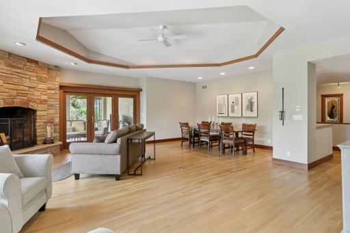 This dining room flows seamlessly into the living room, offering open sightlines and plenty of natural light.