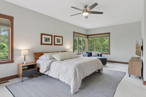 In the primary suite, wake up to wooded views through oversized windows, with room to stretch out, slow down, and carve out a space thatâs all your own.