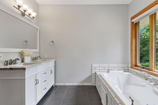 The en-suite bath is designed to make busy mornings easier and quiet evenings more relaxing.