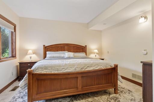 Comfort meets convenience in this well-appointed lower level bedroom that's ideal for guests or family.