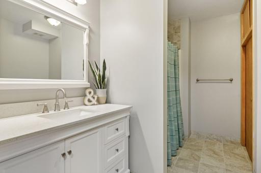 Designed with flexibility in mind, this lower level bathroom is a perfect match for the two nearby bedroomsâwhether for visiting guests or everyday use.