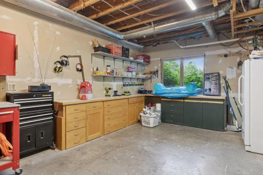 A dedicated workshop space with ample shelving, storage, and countertop room â perfect for projects, hobbies, or DIY repairs.