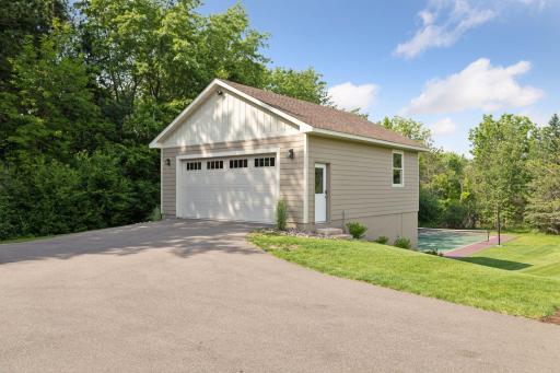 Built in 2022, this spacious two-level 25x29 detached garage provides ample room for storage, boat parking, and more.