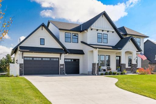 The combination of board-and-batten siding, stone accents, and designer finishes highlight the meticulous attention to detail throughout this property.