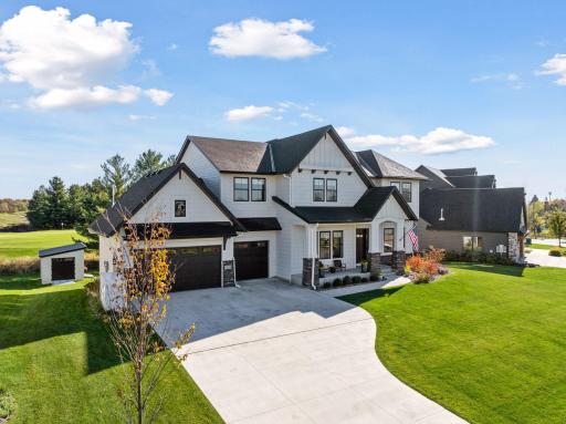The combination of board-and-batten siding, stone accents, and designer finishes highlight the meticulous attention to detail throughout this property.