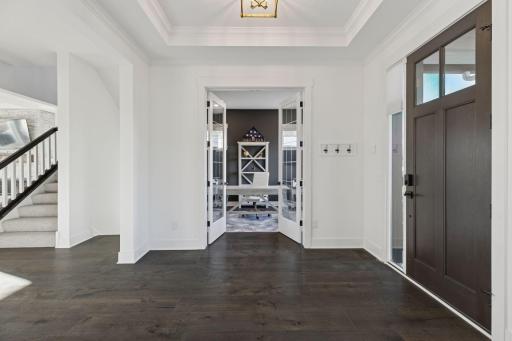 Inside, natural light pours through expansive windows, illuminating an open-concept design that seamlessly blends modern luxury with classic charm.