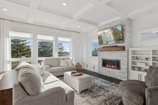 The great room with its stone fireplace offers the perfect retreat.