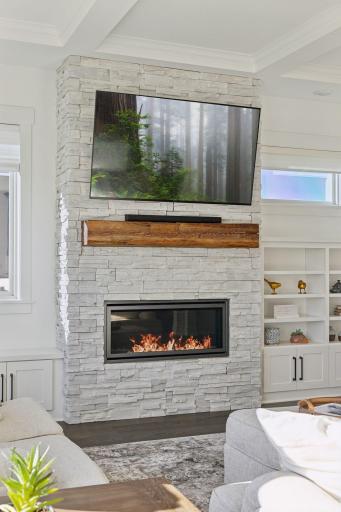 The great room with its stone fireplace offers the perfect retreat.