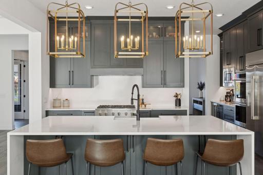 This thoughtfully designed kitchen is a chef's dream! Abundant Storage - Expansive Island - High-End Appliances - Beverage Refrigerator - Coffee Bar - Pantry - Endless space for entertaining!