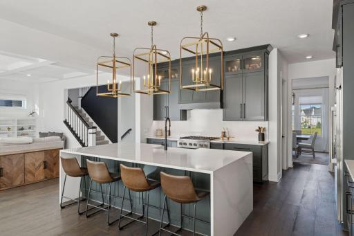 This thoughtfully designed kitchen is a chef's dream! Abundant Storage - Expansive Island - High-End Appliances - Beverage Refrigerator - Coffee Bar - Pantry - Endless space for entertaining!