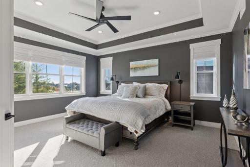 The upper level offers a luxurious primary suite with spa-inspired bath.