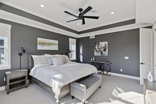 The upper level offers a luxurious primary suite with spa-inspired bath.