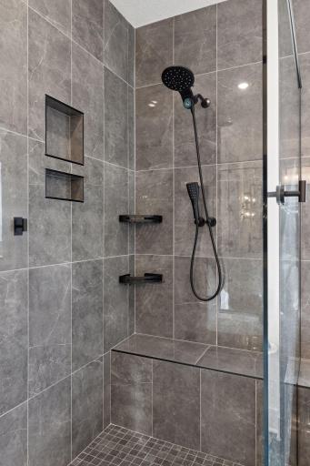 Attention to design and detail continues in the walk-in primary shower.