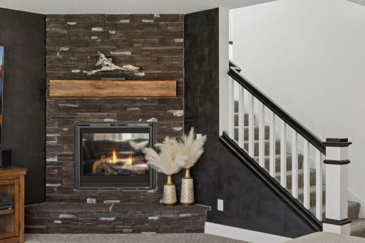 The designer details continue throughout the lower level with an entertainment area that rivals a private club complete with a custom wet bar, gaming space, and access to the beautifully landscaped backyard.