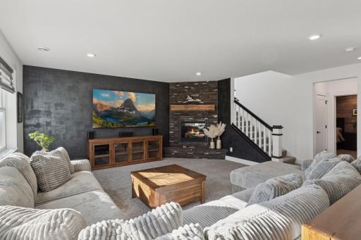 The designer details continue throughout the lower level with an entertainment area that rivals a private club complete with a custom wet bar, gaming space, and access to the beautifully landscaped backyard.