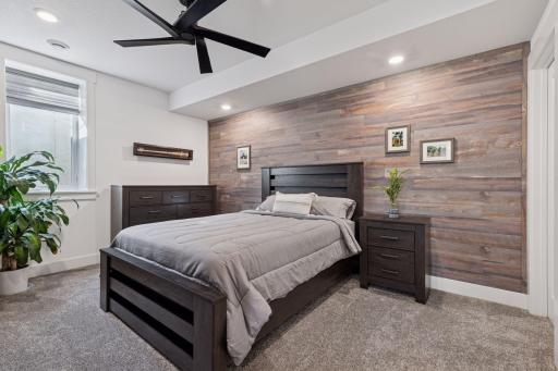 Lower level bedroom with walk-In closet is the perfect escape just steps from entertainment spaces!