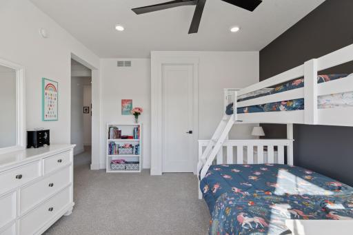 A second bedroom with en suite bathroom provides comfort and privacy for family or guests.