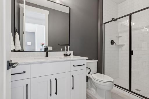 A second bedroom with en suite bathroom provides comfort and privacy for family or guests.