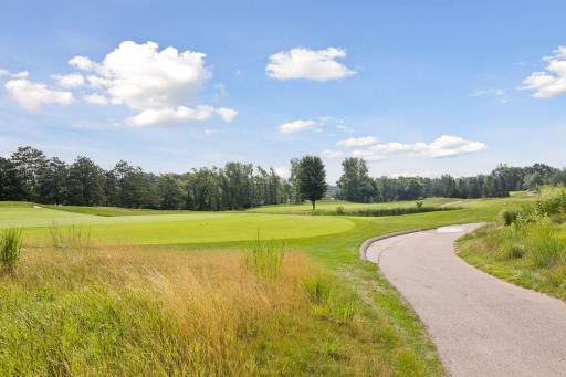 The course features five tee boxes, bent-grass fairways and greens, and scenic views with water features, mature trees, and undulating greens.
