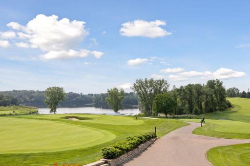 The course features five tee boxes, bent-grass fairways and greens, and scenic views with water features, mature trees, and undulating greens.