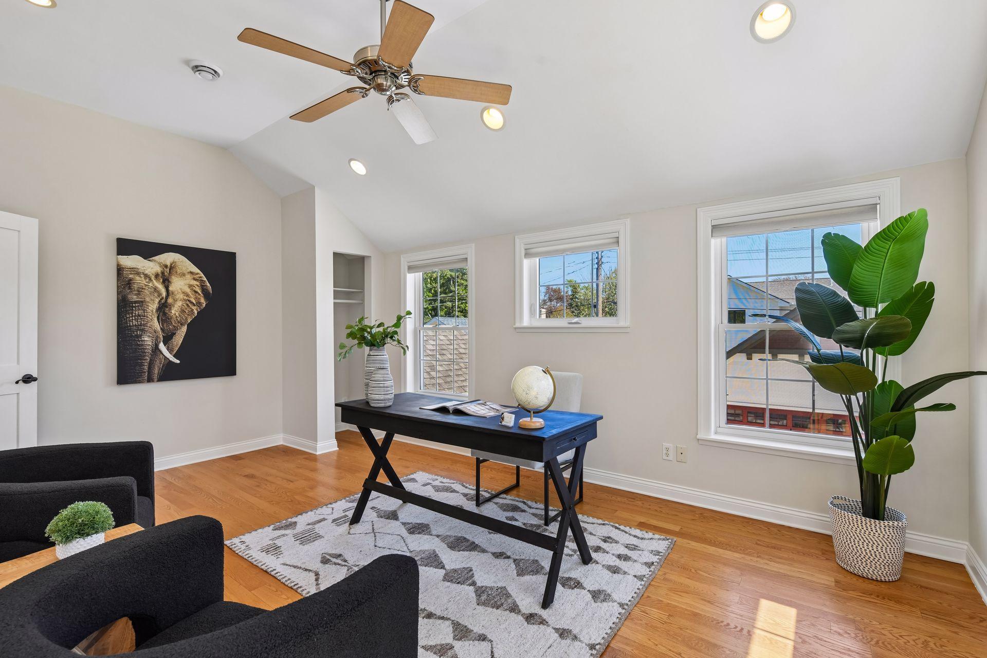 Flex space adjacent to primary suite, staged as an office - would also make a great gym/studio space.