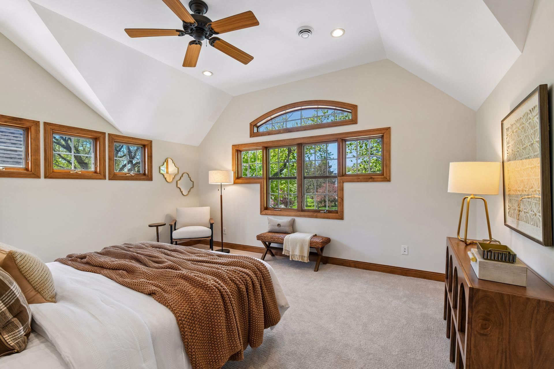 Elegant primary bedroom w/vaulted ceiling