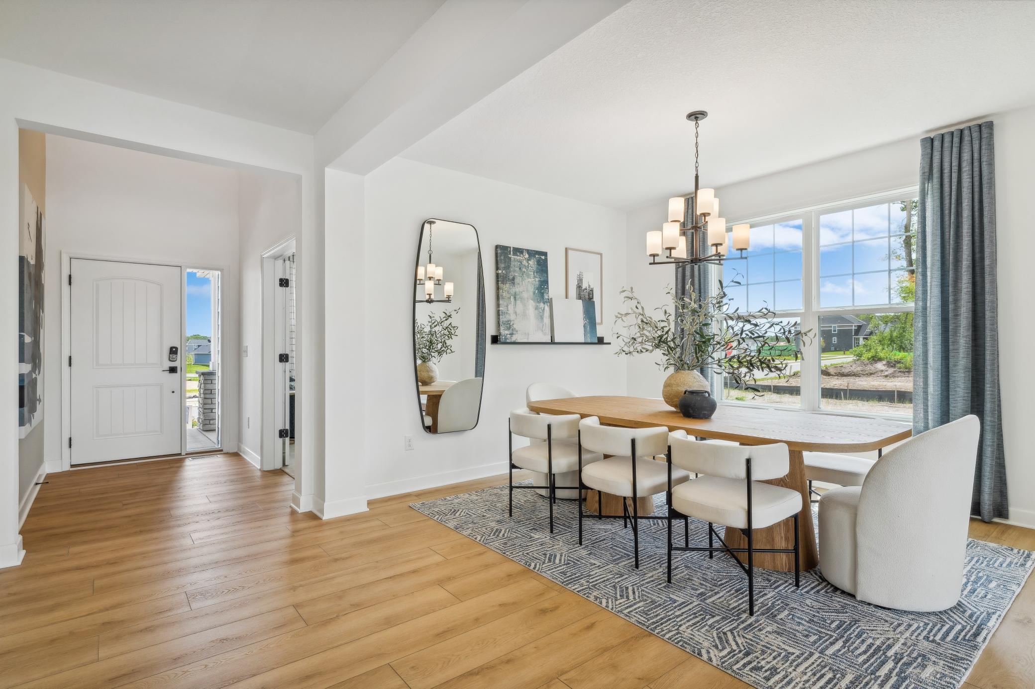 (Photo of model home, finishes will vary) Fit for casual weekend brunches and upscale celebrations alike, the formal dining space joins seamlessly with the Great Room for additional entertaining options.