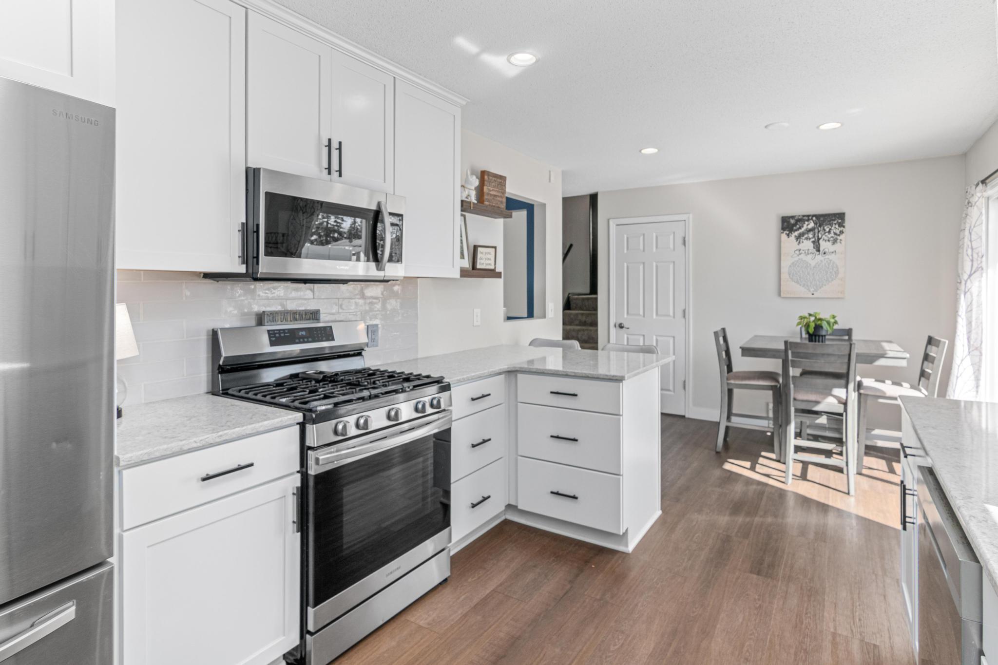 Solid Surface Countertops and Bright Backsplash