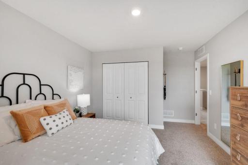 Two secondary bedrooms ideal for guests, office, or hobbies. Photo is of model home. Colors and options may vary. Ask Sales Agent for details.