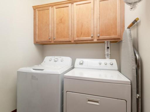 In unit laundry with full sized washer and dryer.