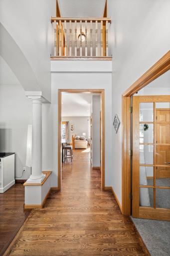 Stunning 2 story entry guides you into this sun-drenched home.