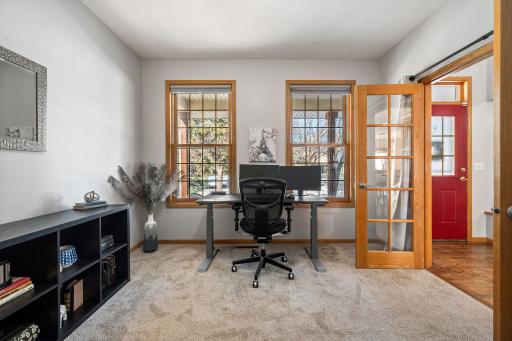 Currently used as a home office - this room offers great natural light and french doors.
