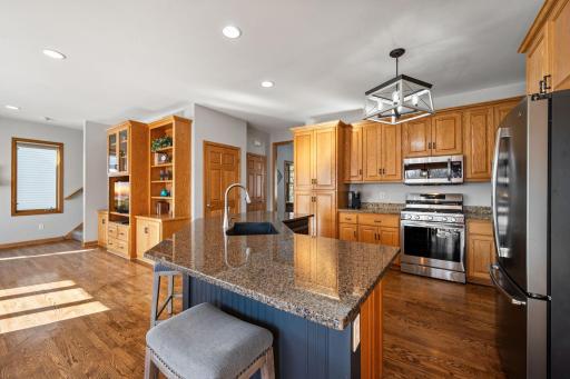 Hardwood Floors, Granite counters and SS appliances are featured in this lovely kitchen.