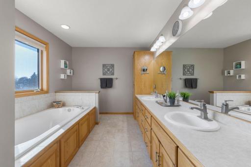Private bath features double sinks, separate shower and jetted tub.