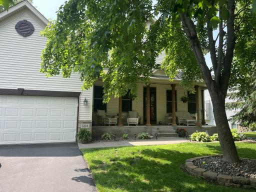 Enjoy a beautiful front yard from the serenity of your front porch