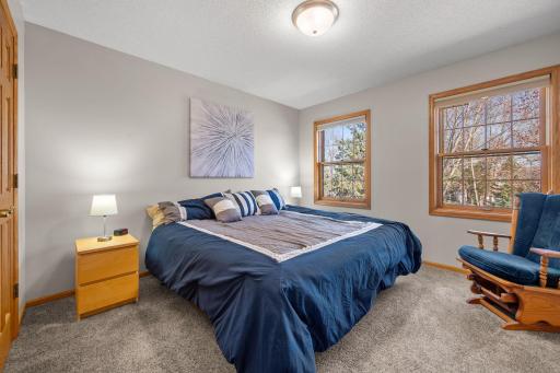 A 3rd upper level bedroom has generous size and neutral decor.